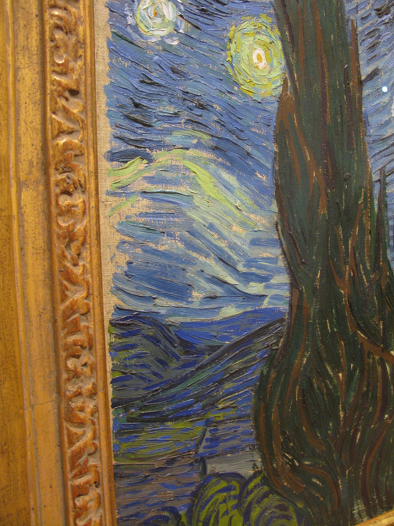 Close-up detail of the dark rising cypress in The Starry Night