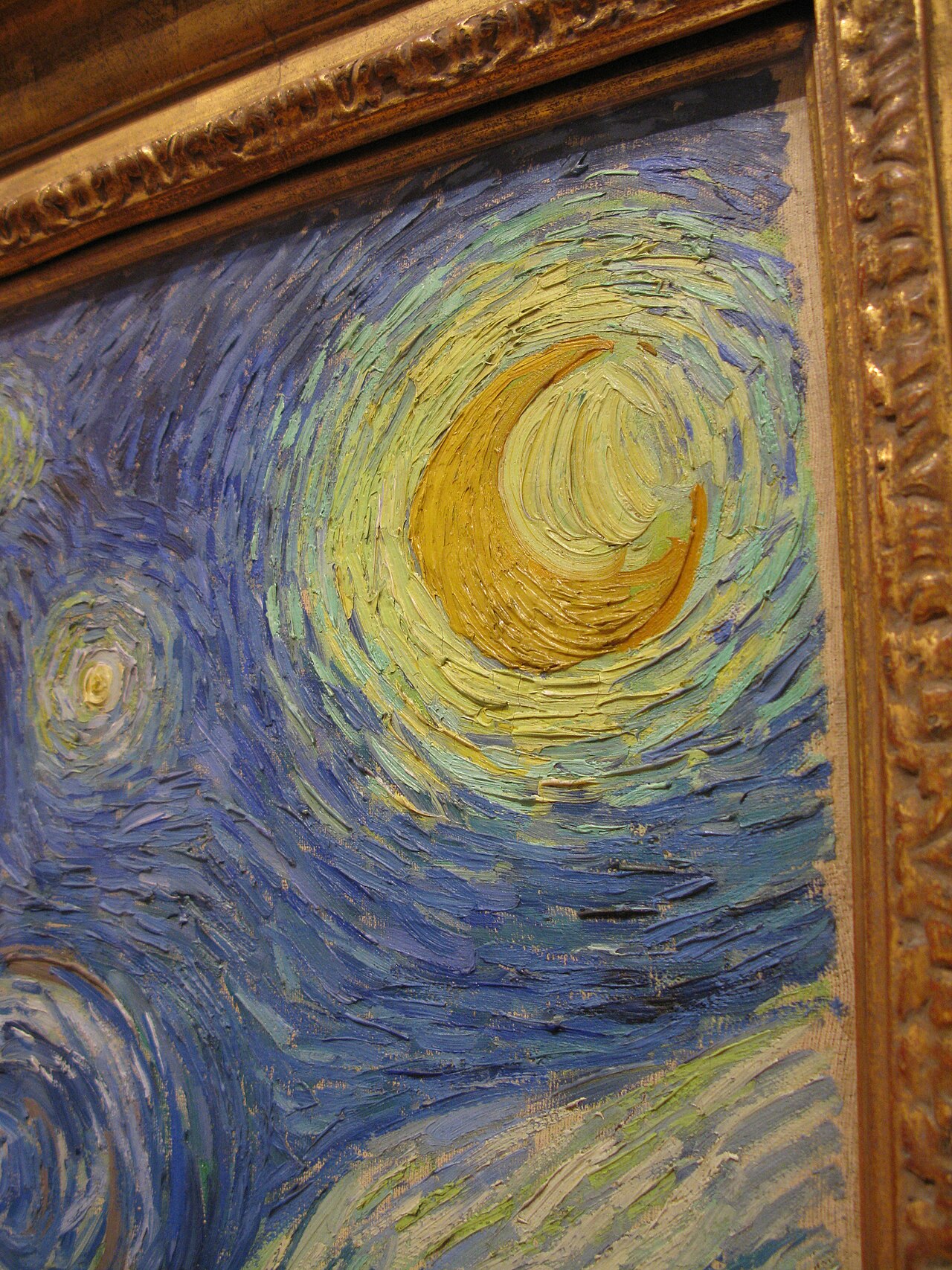 Close-up detail of the swirling sky and stars in The Starry Night